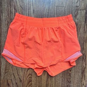 Highlight orange lululemon size 6 4 inch shorts
